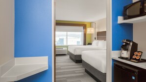 A hotel room with two beds, a microwave, a coffee machine, and a view of the city. - Holiday Inn Express and Suites Union Gap- Yakima Area by IHG (Yakima)