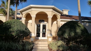 Welcome to the classic entrance of our building, featuring a central entrance flanked by two rounded archways.