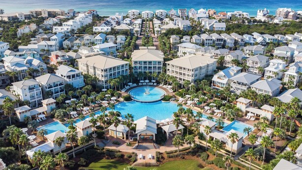 A resort with multiple buildings, a central swimming pool, and a view of the ocean. - Seacrest's Forever & Always + Pool, Tram & Bikes (Seacrest)