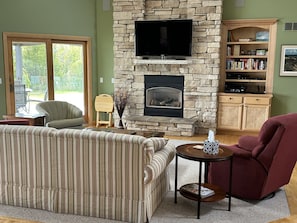 Smart TV, fireplace, DVD player, books