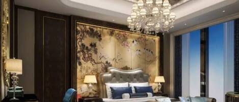 A luxurious bedroom with a large bed, a sofa, a chandelier, and a decorative wall panel.