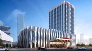 A modern hotel with a unique wavy facade and a prominent 'BISMAR' sign. - Wanda Realm Qiqihar (Qiqihar)