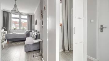 Habitación doble Deluxe | Tabla de planchar con plancha, wifi gratis y ropa de cama