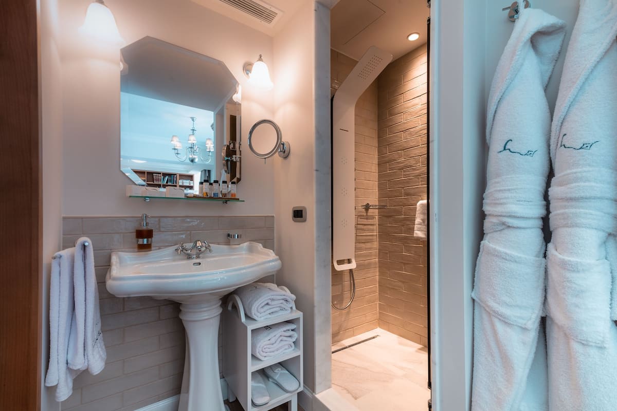 k suite sea view | bathroom | shower, free toiletries, hair dryer, bathrobes