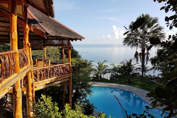 Breakfast, lunch served; local and international cuisine, pool views