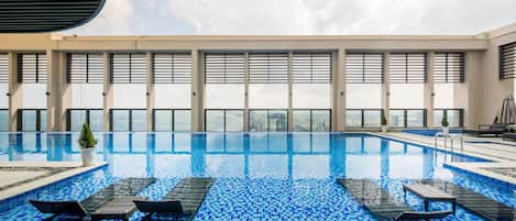 Indoor pool, a rooftop pool, open 6:00 AM to 9:00 PM, pool umbrellas