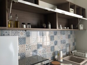 Fridge, microwave, stovetop, coffee/tea maker