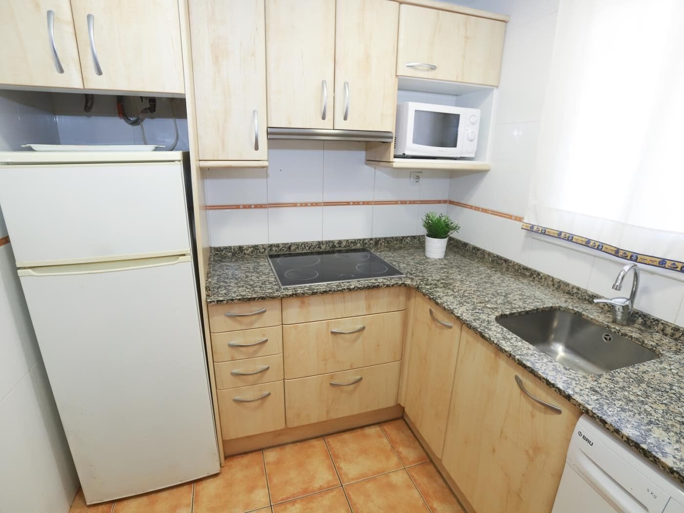 Fridge, microwave, cookware/dishes/utensils