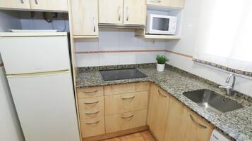 Fridge, microwave, cookware/dishes/utensils