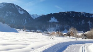 A snowy mountain landscape with a clear sky.