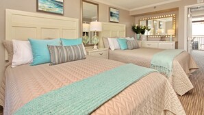 A hotel room with two beds, a large mirror, and a view of the beach. - Beautiful 1Bd/1Ba Condo in Beachside Resort on The Golden Mile (Myrtle Beach)