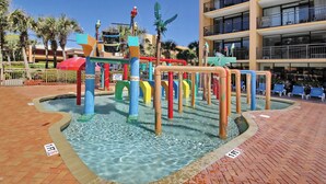A water play area with colorful structures and palm trees in the background. - Beautiful 1Bd/1Ba Condo in Beachside Resort on The Golden Mile (Myrtle Beach)
