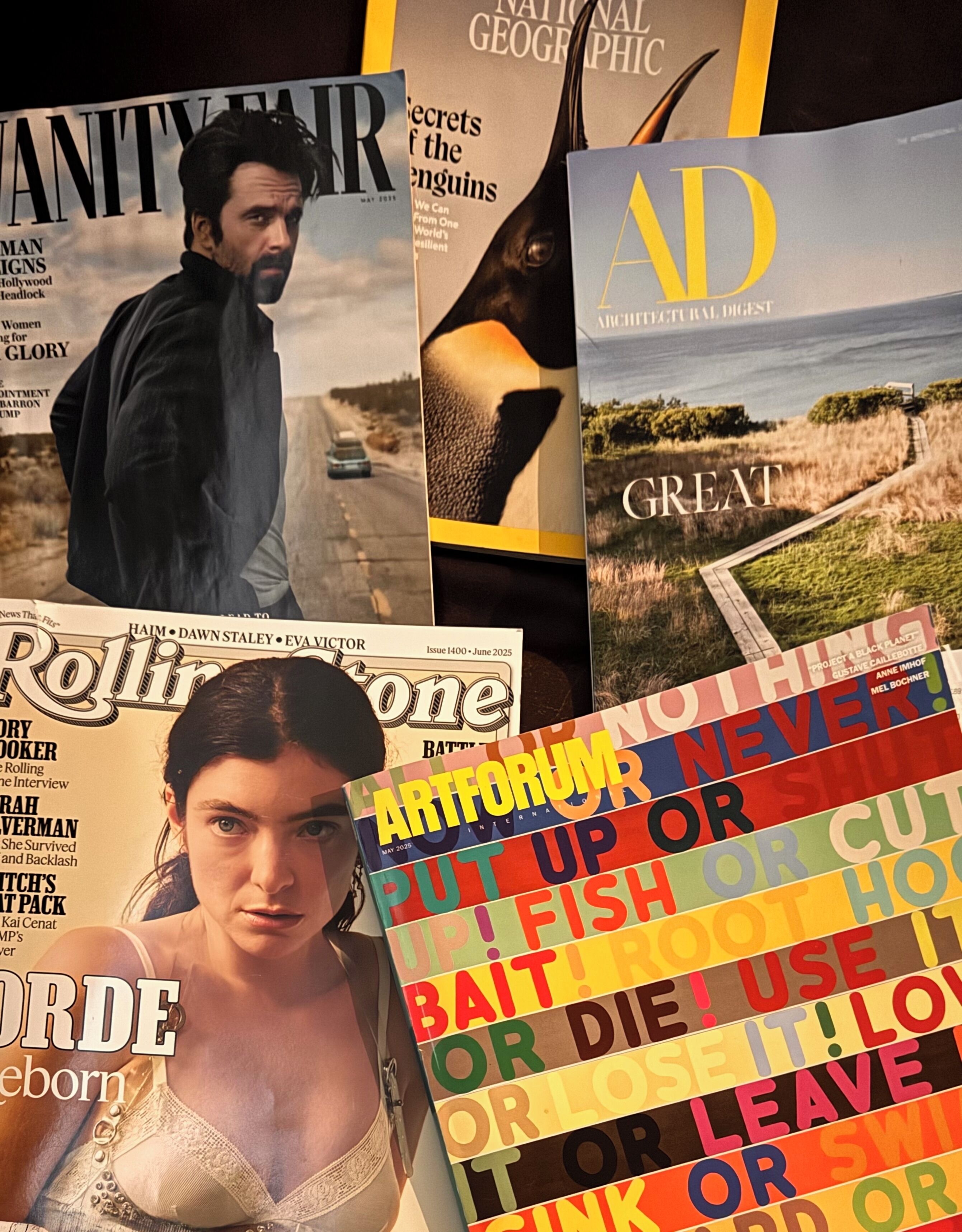 A collage of magazine covers including Vanity Fair, Rolling Stone, and Artforum.