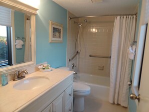 Combined shower/tub, hair dryer, towels, soap