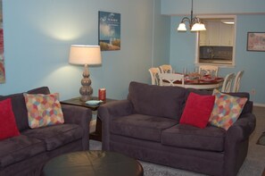TV, DVD player, video library - Cozy Coastal Retreat • Ocean Views + Roomy Condo • Walk to the Beach in Minutes! (Myrtle Beach)