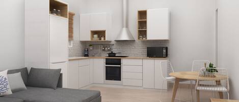 A modern kitchen with white cabinets, a microwave, and an oven. There is a dining area with a table and chairs.