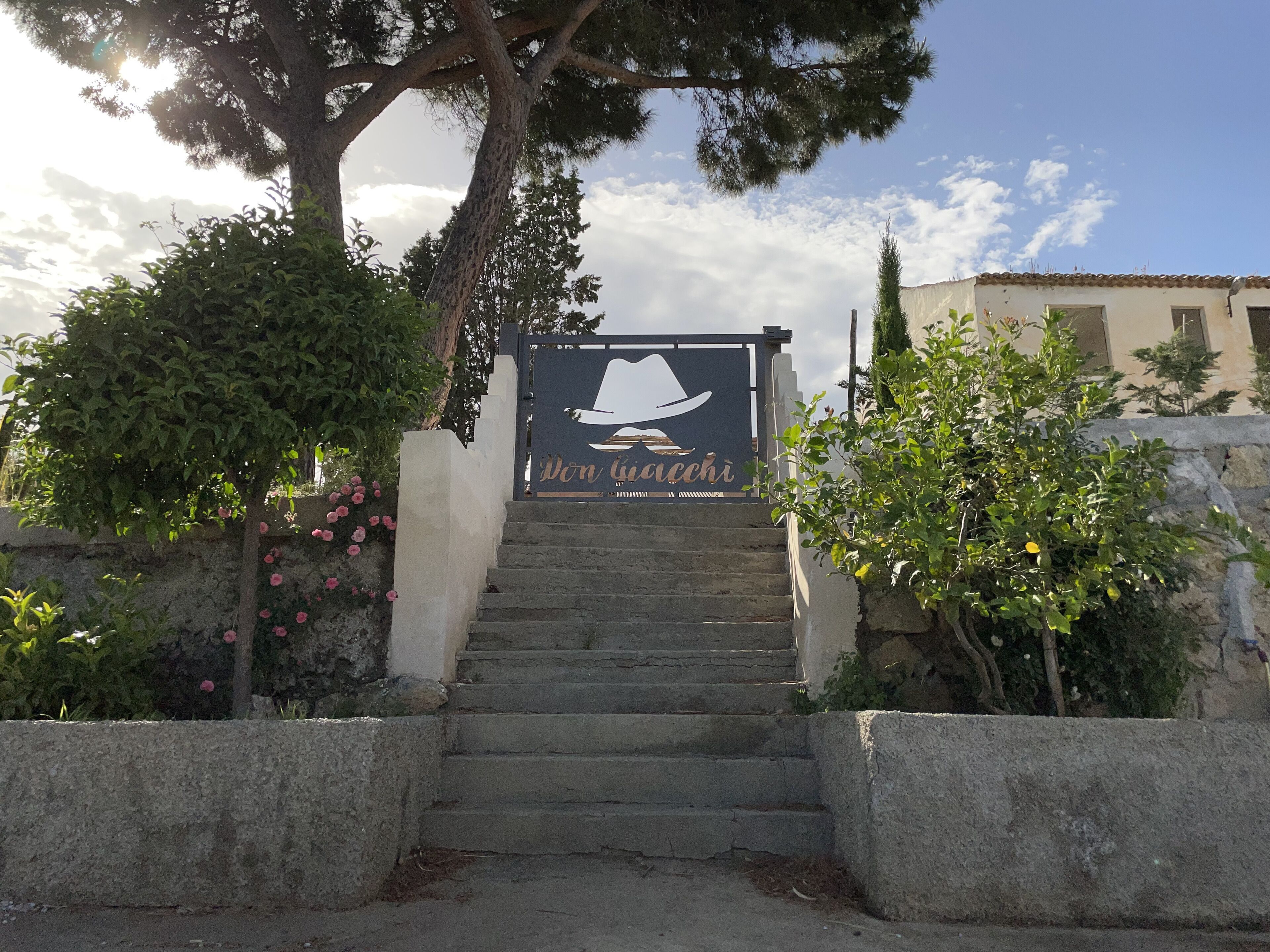 A staircase leading to a building with a sign reading "Don Riccati."