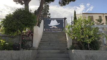 A staircase leading to a building with a sign reading "Don Riccati."