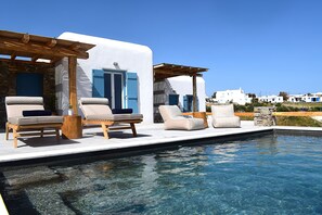 Outdoor pool, a heated pool, sun loungers