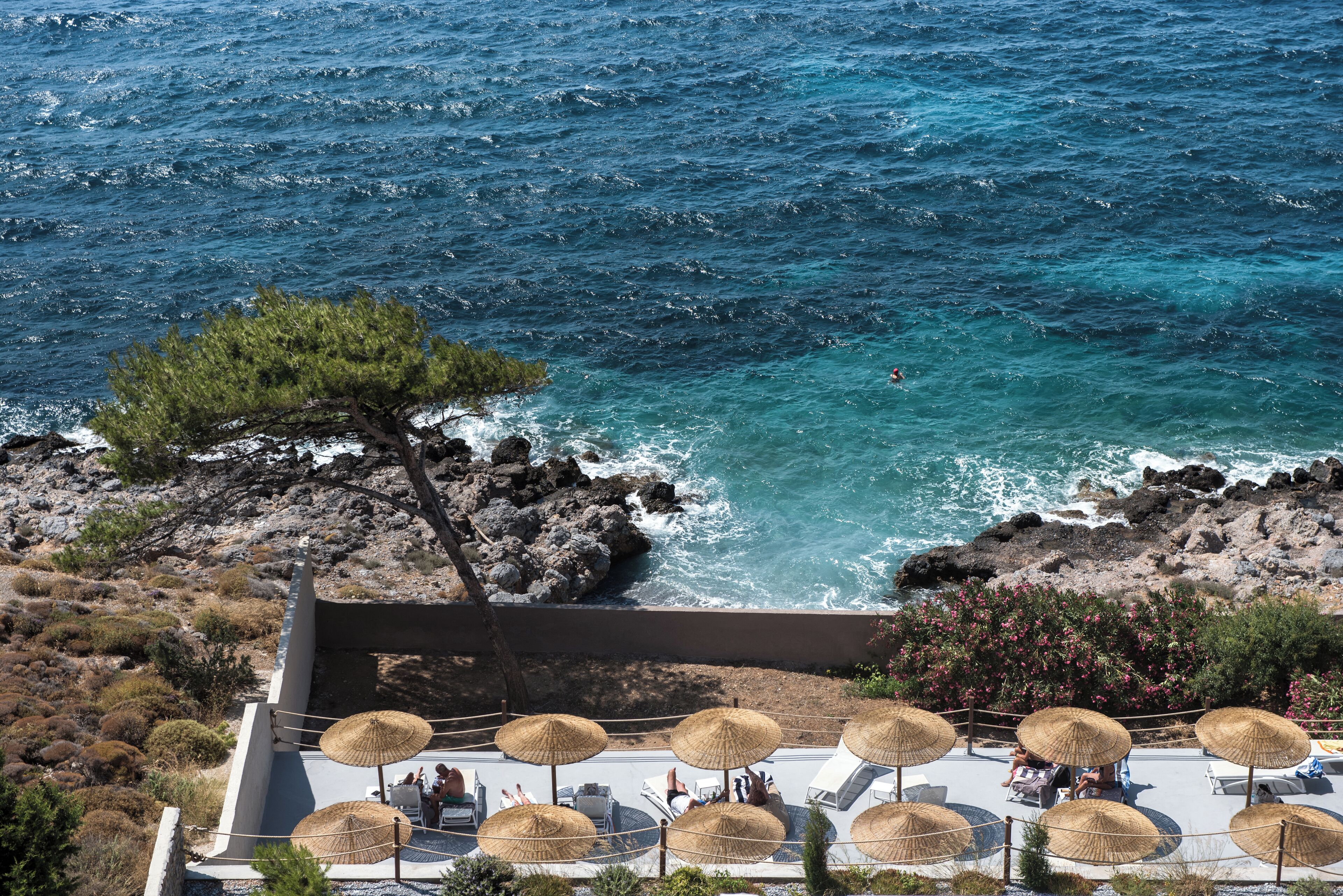 Seasonal outdoor pool, open 9 AM to 8:30 PM, pool umbrellas