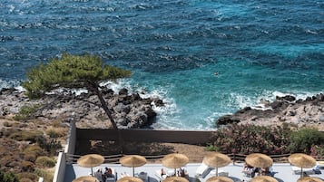 Seasonal outdoor pool, open 9 AM to 8:30 PM, pool umbrellas