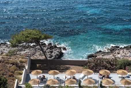 Seasonal outdoor pool, open 9 AM to 8:30 PM, pool umbrellas. Carian Hotel