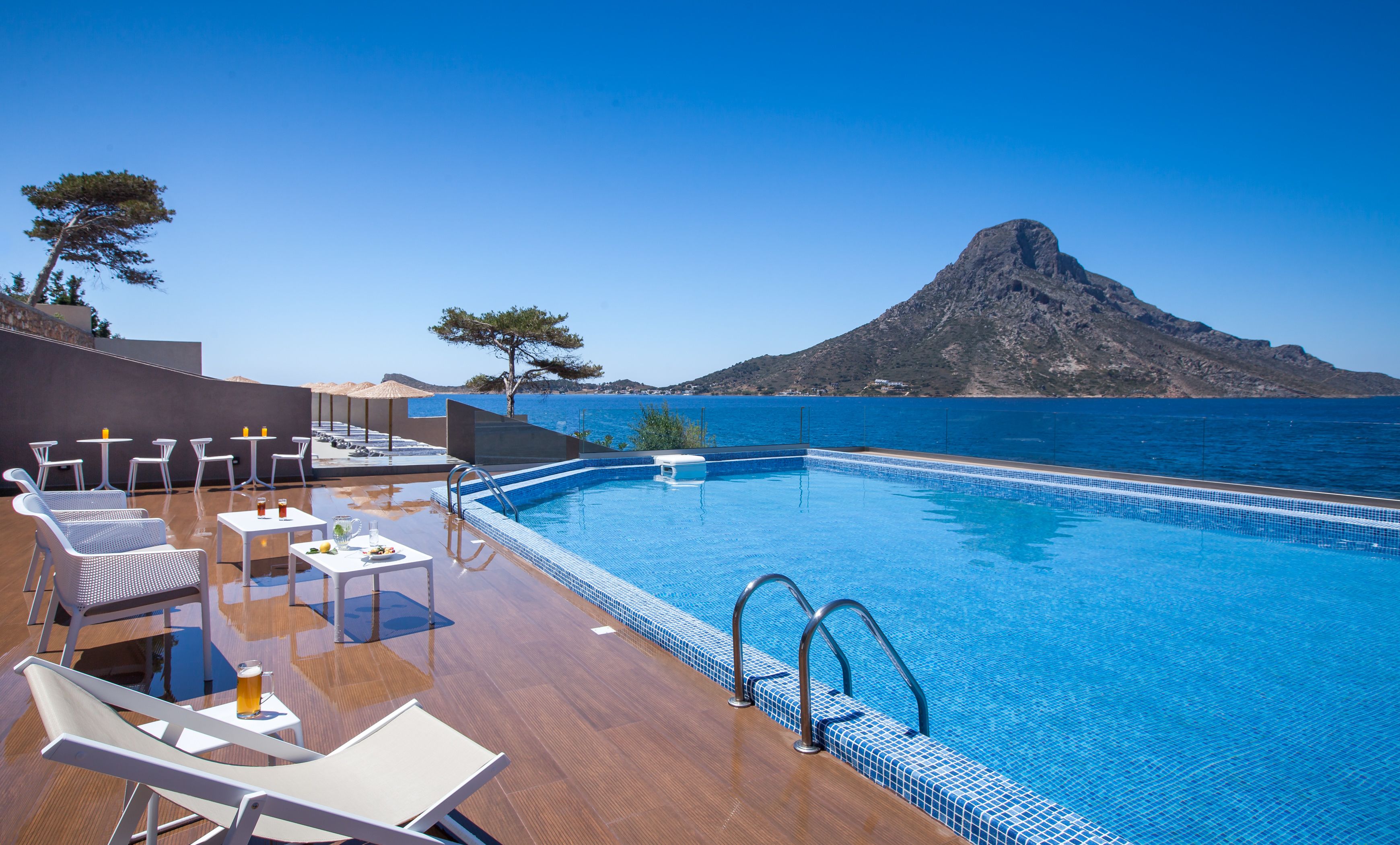 Seasonal outdoor pool, open 9 AM to 8:30 PM, pool umbrellas