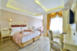 Family Triple Room | Minibar, in-room safe, desk, blackout drapes - Nayla Palace Hotel (Istanbul)