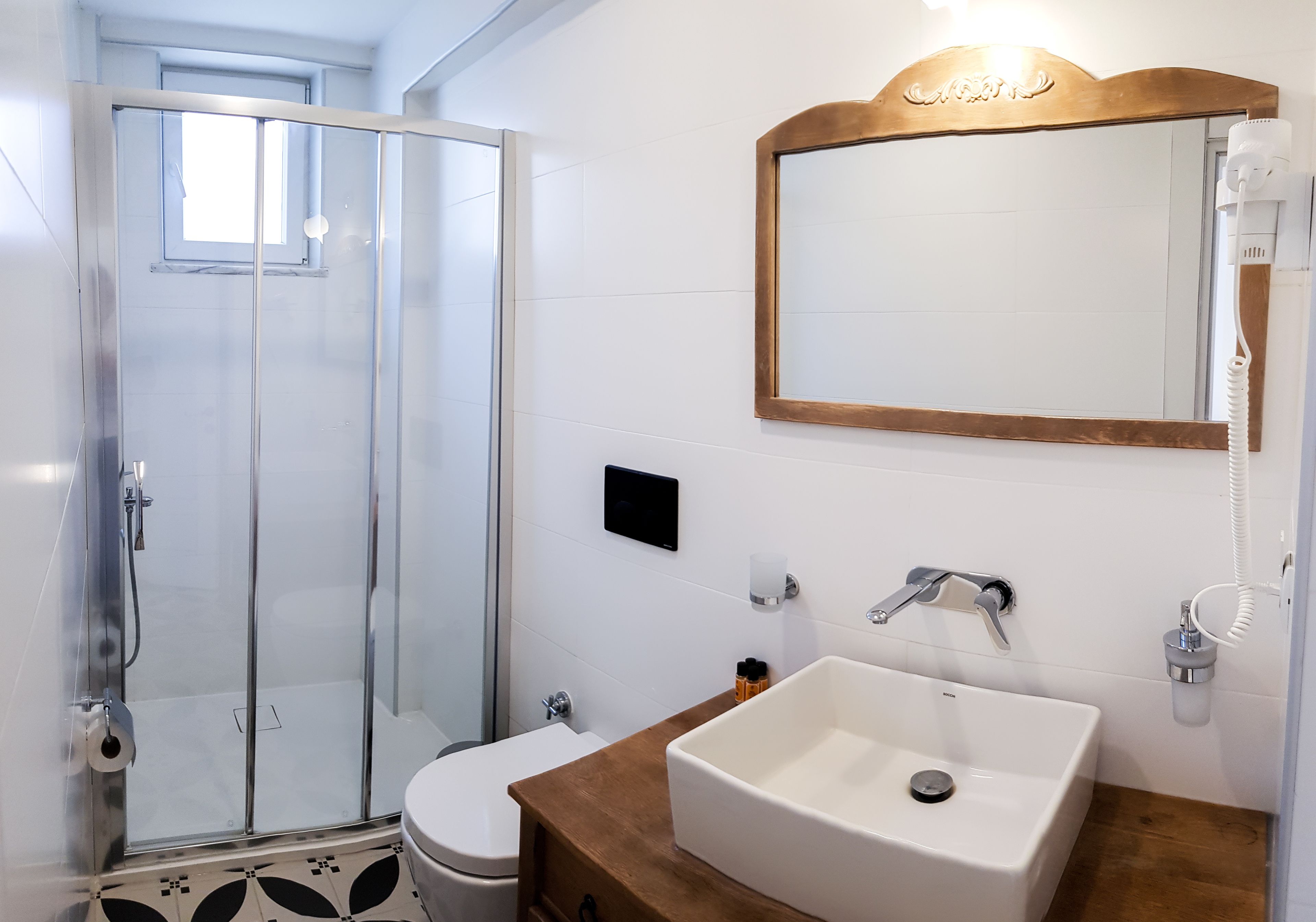 deluxe room | bathroom | shower, free toiletries, hair dryer, towels