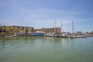 Guests can enjoy stunning views of the marina from the thatched-roof structure.