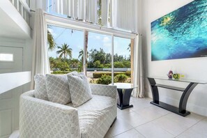 TV, offices - Island House #12 | 2BR Waterfront Condo at Rum Point (Rum Point)