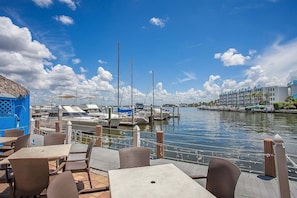 Outdoor dining - Waterfront 1BR condo in Marco Island with pool, WiFi & marina access. (Marco Island)