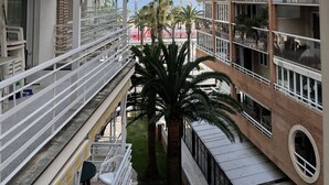 A multi-story hotel with balconies, a pool area, and a view of the beach. - Alexis plus Zeus Salou 0141 (Salou)