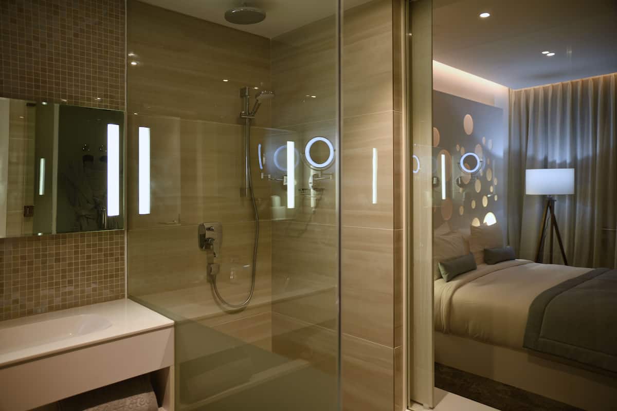 superior double room | bathroom | shower, free toiletries, hair dryer, bathrobes