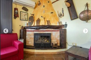 TV, fireplace, books, stereo