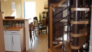 A modern kitchen with wooden cabinets and a built-in dishwasher. - Apartment/ flat - COLLIOURE (Collioure)