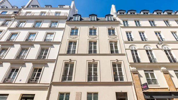 A row of multi-story buildings with uniform architectural style, featuring balconies and large windows. - Sweett | Monsigny V - One Bedroom Apartment, Sleeps 3 (Paris)