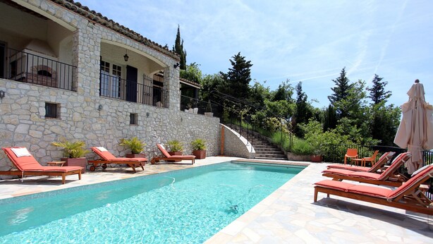 A stone building with a swimming pool, lounge chairs, and potted plants. - Villa with a breathtaking view, in a quiet countryside,  <br>One week minimum rent  (Saint-Jeannet)