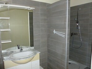 Shower, hair dryer, towels, toilet paper