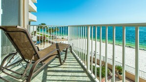 A balcony with wicker chairs overlooking a beach. - 🌴Stunning Panoramic Gulf Views~Boat Slip~Huge Balcony~2BR Waterview Towers 202 (Destin)