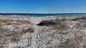 A beach with sand and sparse vegetation. - Mamaw's Spot | Oceanfront + Pet Friendly! (Topsail Beach)