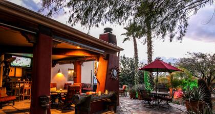 12 bedrooms Custom Home w/ 2 casita's, 18-hole chipping course & man-cave