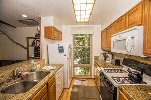 Fridge, microwave, oven, stovetop - Villas # 78 by Hauserman Rentals (Tahoe City)