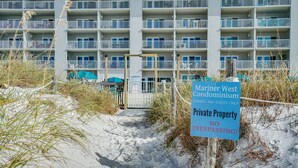 A beachfront condominium with a sign indicating it is private property and no trespassing. - Beachfront | 1st Floor Condo | Mariner West | Pool (Panama City Beach)