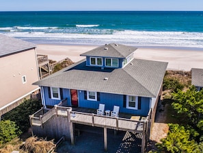 A two-story beach house with a deck, a covered patio, and a view of the ocean. - All About The View | Oceanfront In Topsail Beach (Topsail Beach)