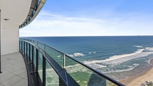 A balcony with a glass railing overlooking the ocean. - Esplanade (Soul) - Apartment Stay Private (Surfers Paradise)