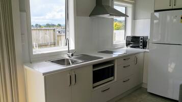 Apartment, 1 Bedroom | Private kitchen | Full-sized fridge, microwave, oven, stovetop