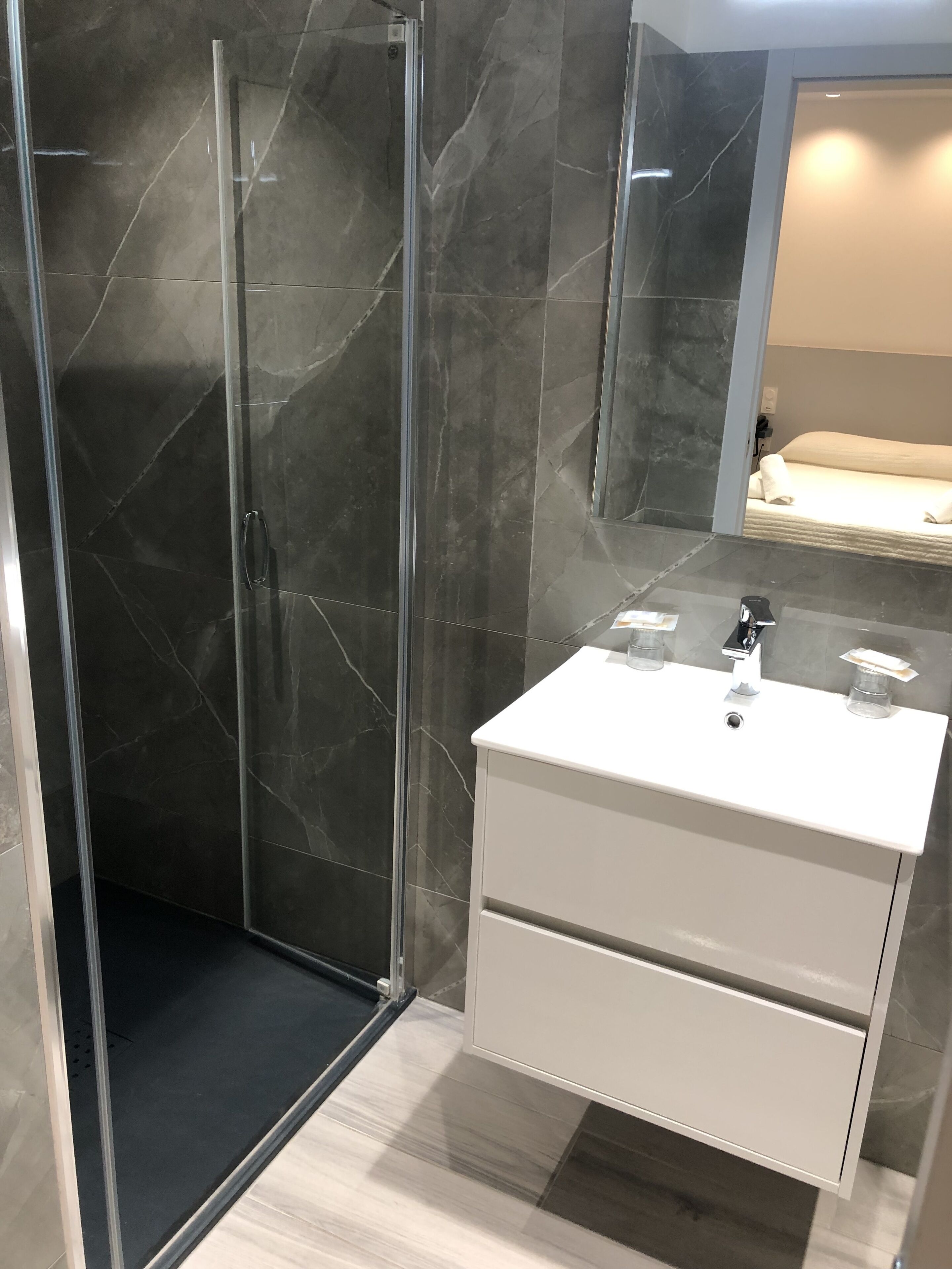 shower, free toiletries, hair dryer, towels