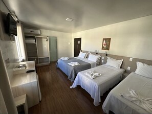 Deluxe Quadruple Room | Minibar, desk, blackout drapes, soundproofing