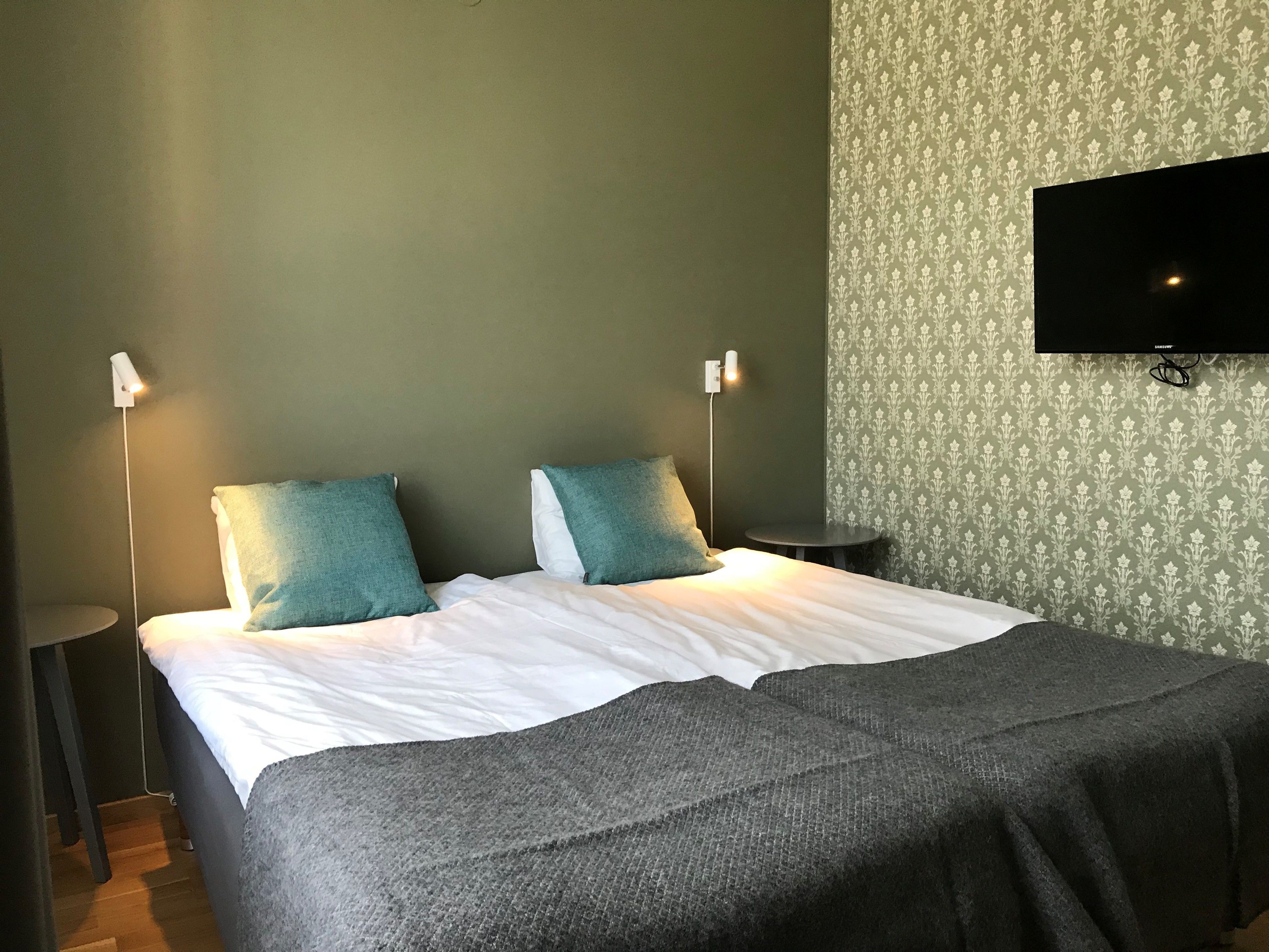 basic double room | pillow-top beds, desk, laptop workspace, blackout curtains